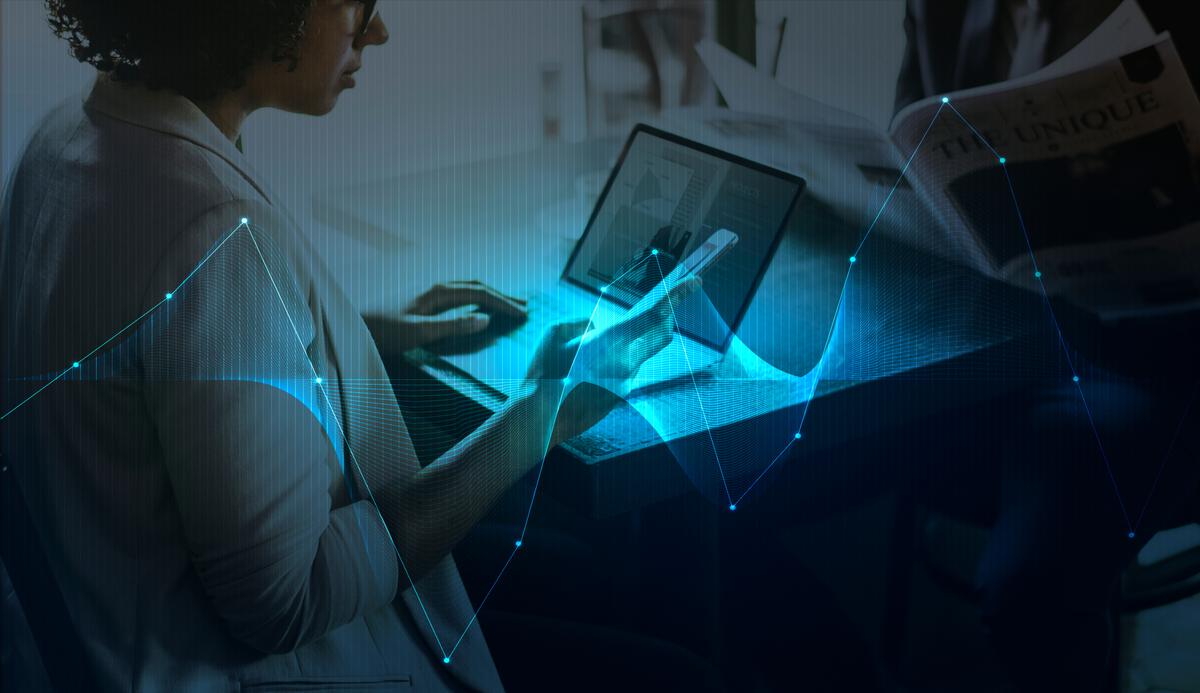 Professional woman working with digital technology and data visualization
